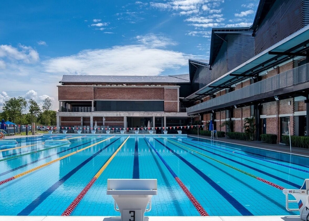 Outdoor pool at Estuari Sports Complex, Iskandar Puteri, Johor, MY, under clear blue skies.