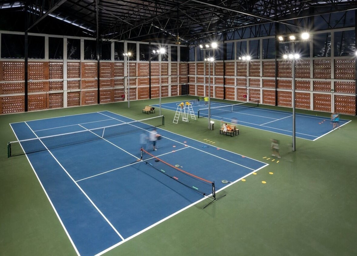 Indoor tennis courts at Estuari Sports Complex, Iskandar Puteri, Johor, MY, offering a vibrant sports experience.