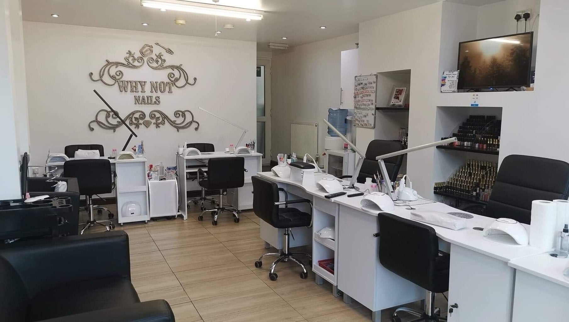 Spacious and stylish nail studio interior at Why Not, Loughborough, England, GB, featuring modern manicure stations.