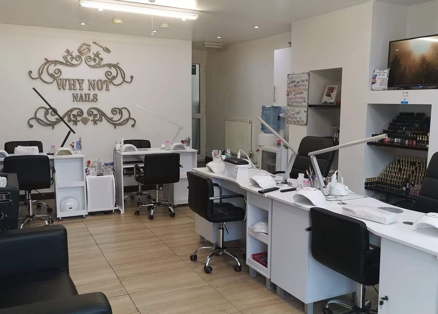 Spacious and stylish nail studio interior at Why Not, Loughborough, England, GB, featuring modern manicure stations.