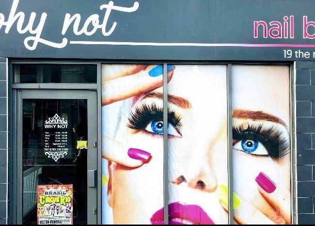 Front view of Why Not nail bar in Loughborough, England, GB featuring a colorful beauty mural.