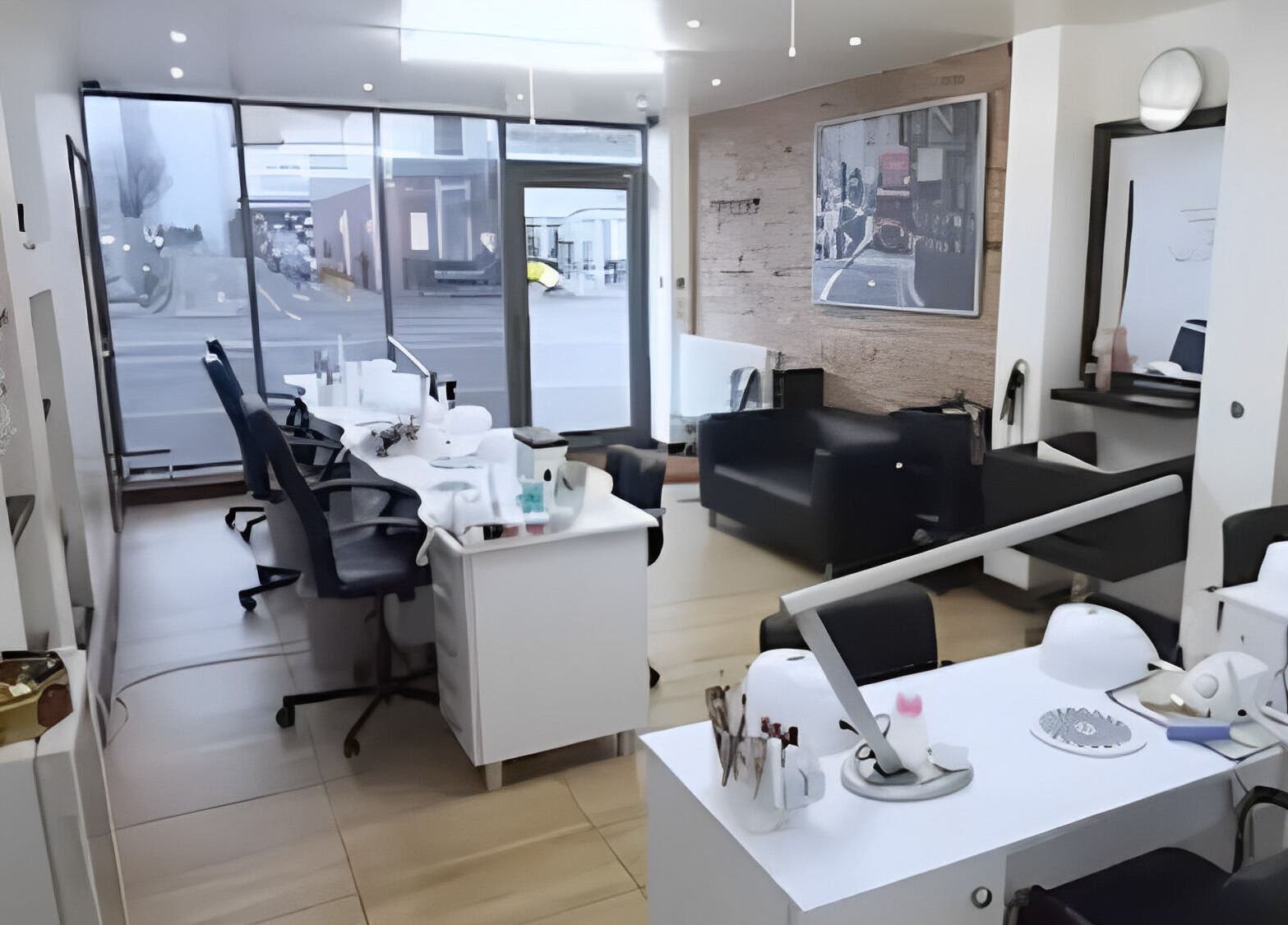 Interior view of Why Not beauty salon in Loughborough, England, GB, featuring stylish manicure stations.