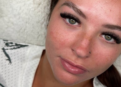 Elegant eyelash extensions at Lashed Up in Swindon, England, GB, highlighting lush lashes and flawless complexion.