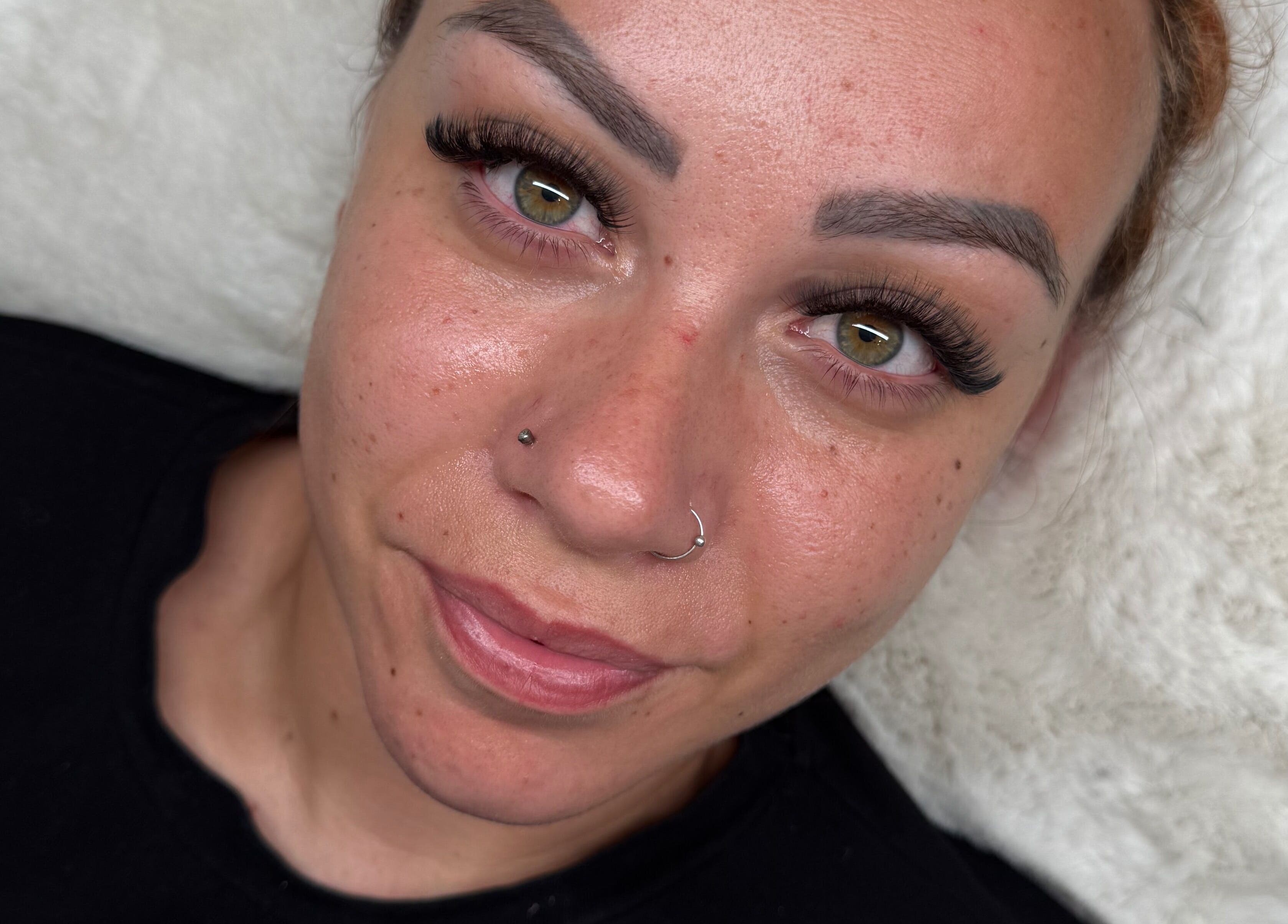 Client with enhanced eyelashes at Lashed Up, Swindon, England, GB showcasing natural beauty and lash treatment.