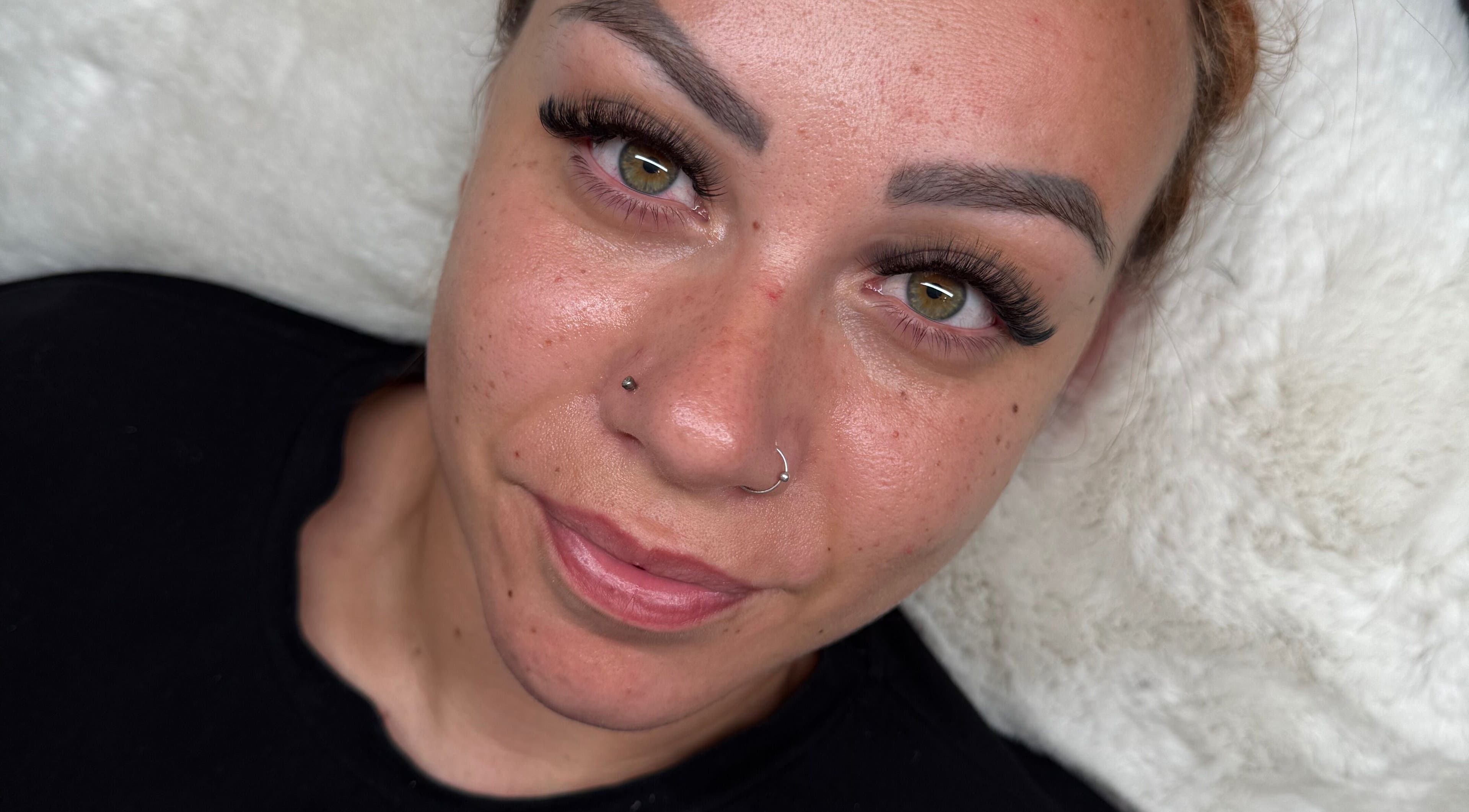 Client with enhanced eyelashes at Lashed Up, Swindon, England, GB showcasing natural beauty and lash treatment.