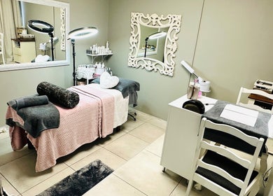 Tranquil treatment room at INDIVIDUELLE SKIN & BODY in Durban, Kwazulu-natal, ZA featuring plush furnishings.