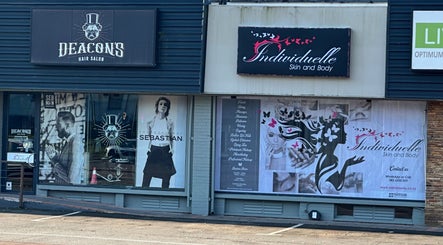 Exterior of INDIVIDUELLE SKIN & BODY in Durban, Kwazulu-natal, ZA showcasing stylish signage and neighboring shops.