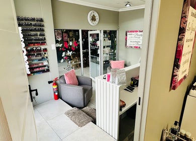 Cozy sitting area with nail polish display at INDIVIDUELLE SKIN & BODY, Durban, Kwazulu-natal, ZA.