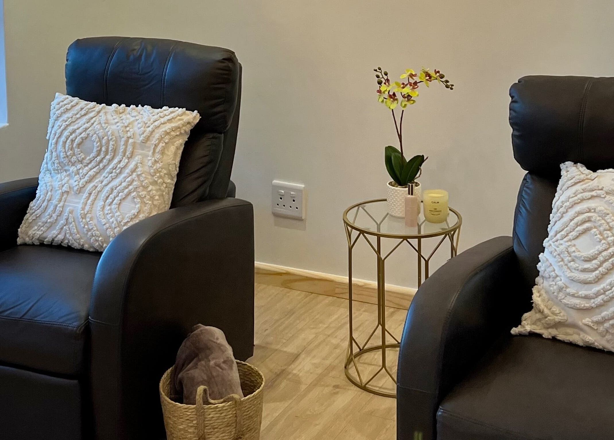 Relaxing lounge area at Orchid Aesthetics ZA in Cape Town, Western Cape, ZA with plush chairs and decor.