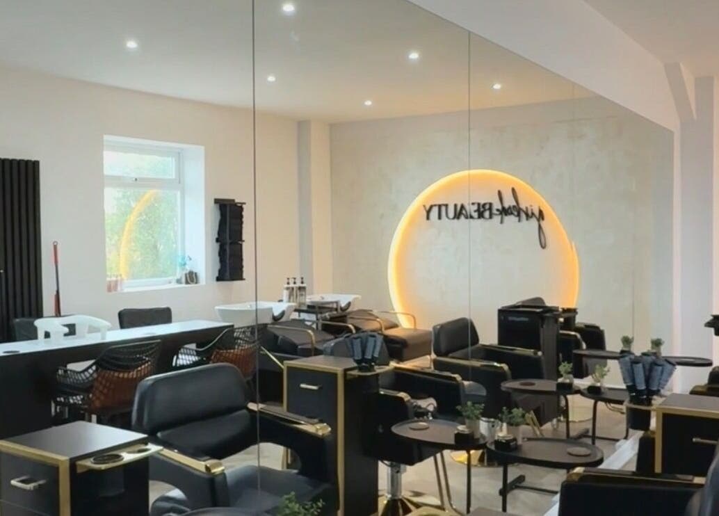 Stylish interior of Girlcode Beauty Studio, Wirral, England, GB, featuring modern salon chairs and elegant decor.