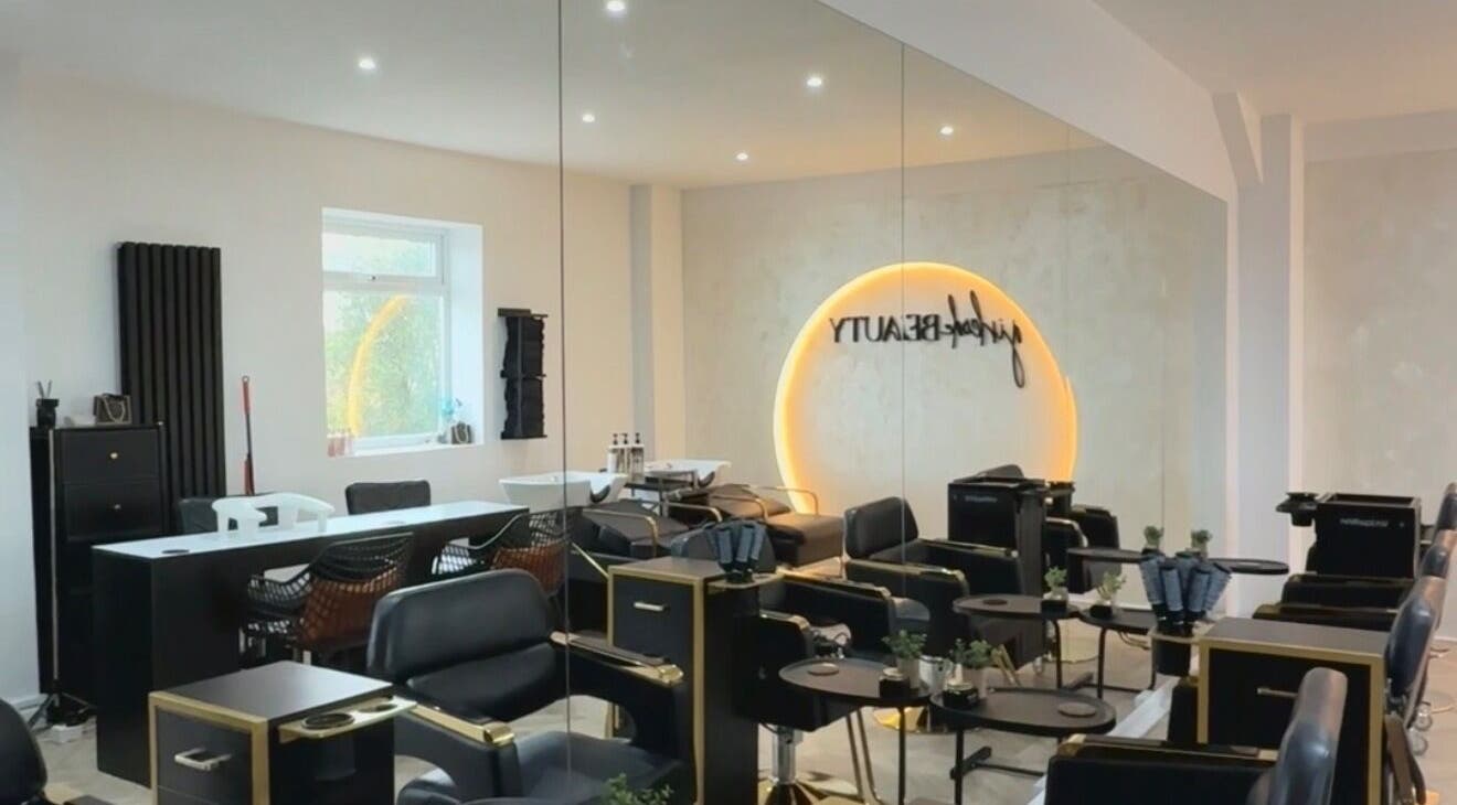 Stylish interior of Girlcode Beauty Studio, Wirral, England, GB, featuring modern salon chairs and elegant decor.