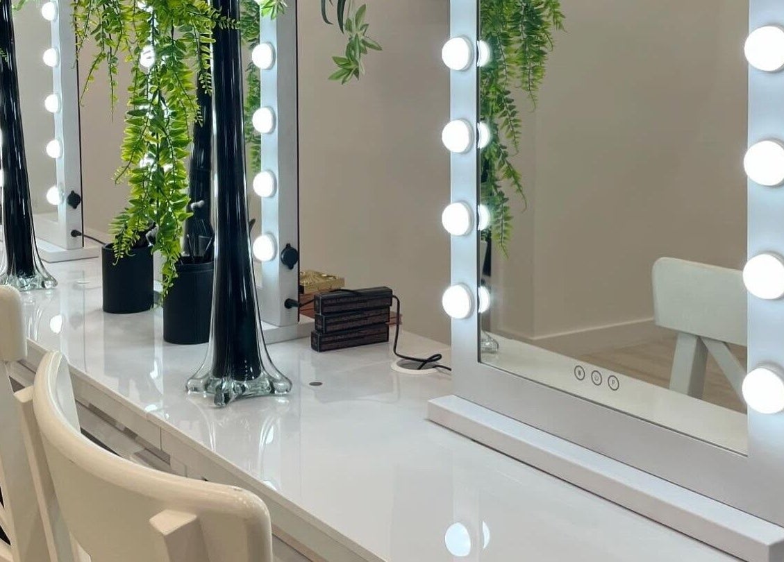 Elegant vanity mirrors with lights and greenery at Gloglam, Main Beach, Queensland, AU.