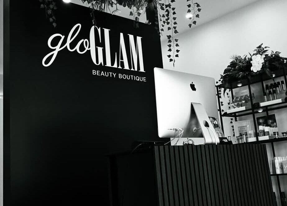 Reception area at Gloglam, Main Beach, Queensland, AU showcasing modern decor and beauty products.