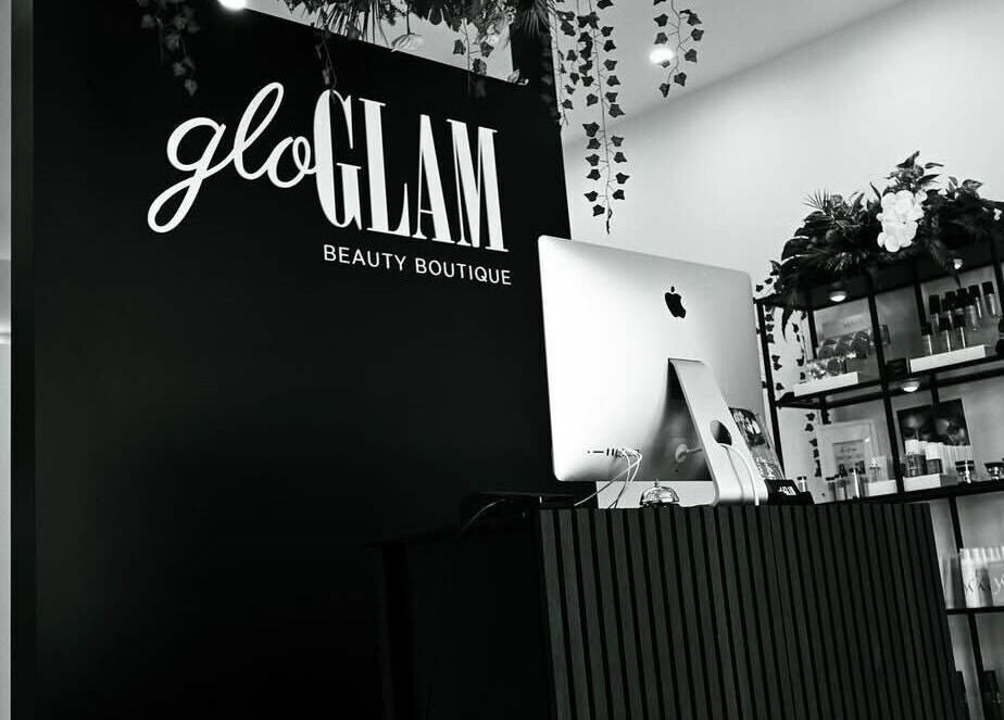 Reception area at Gloglam, Main Beach, Queensland, AU showcasing modern decor and beauty products.