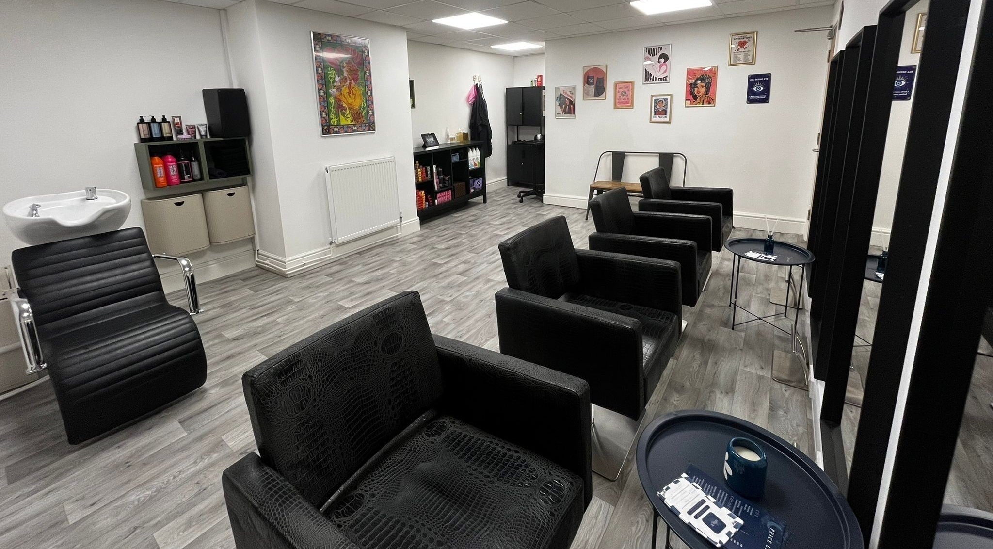 Elegant interior of Shaer Atelier in Bury, England, GB showcasing sleek chairs and stylish decor.