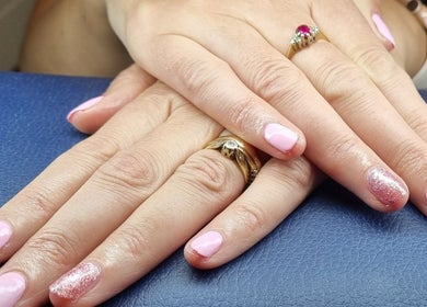 Elegant pink manicure with glitter accent at The Beauty Pond, Swindon, England, GB.