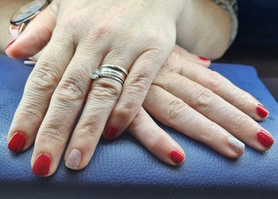 Elegant red and silver nails showcased at The Beauty Pond, Swindon, England, GB.