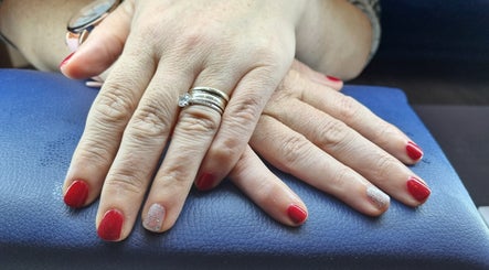 Elegant red and silver nails showcased at The Beauty Pond, Swindon, England, GB.