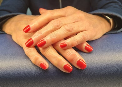 Elegant red nails at The Beauty Pond in Swindon, England, GB.