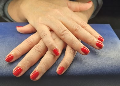 Fresh red manicure at The Beauty Pond, Swindon, England, GB, showcasing detailed nail artistry.