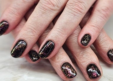 Stylish galaxy-themed manicure at The Beauty Pond, Swindon, England, GB.
