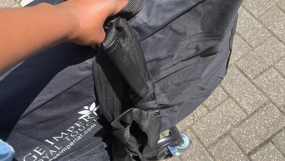 Close-up of a hand holding a portable spa kit from Original Goddess Earth Energy — Mobile Services, London, England, GB.