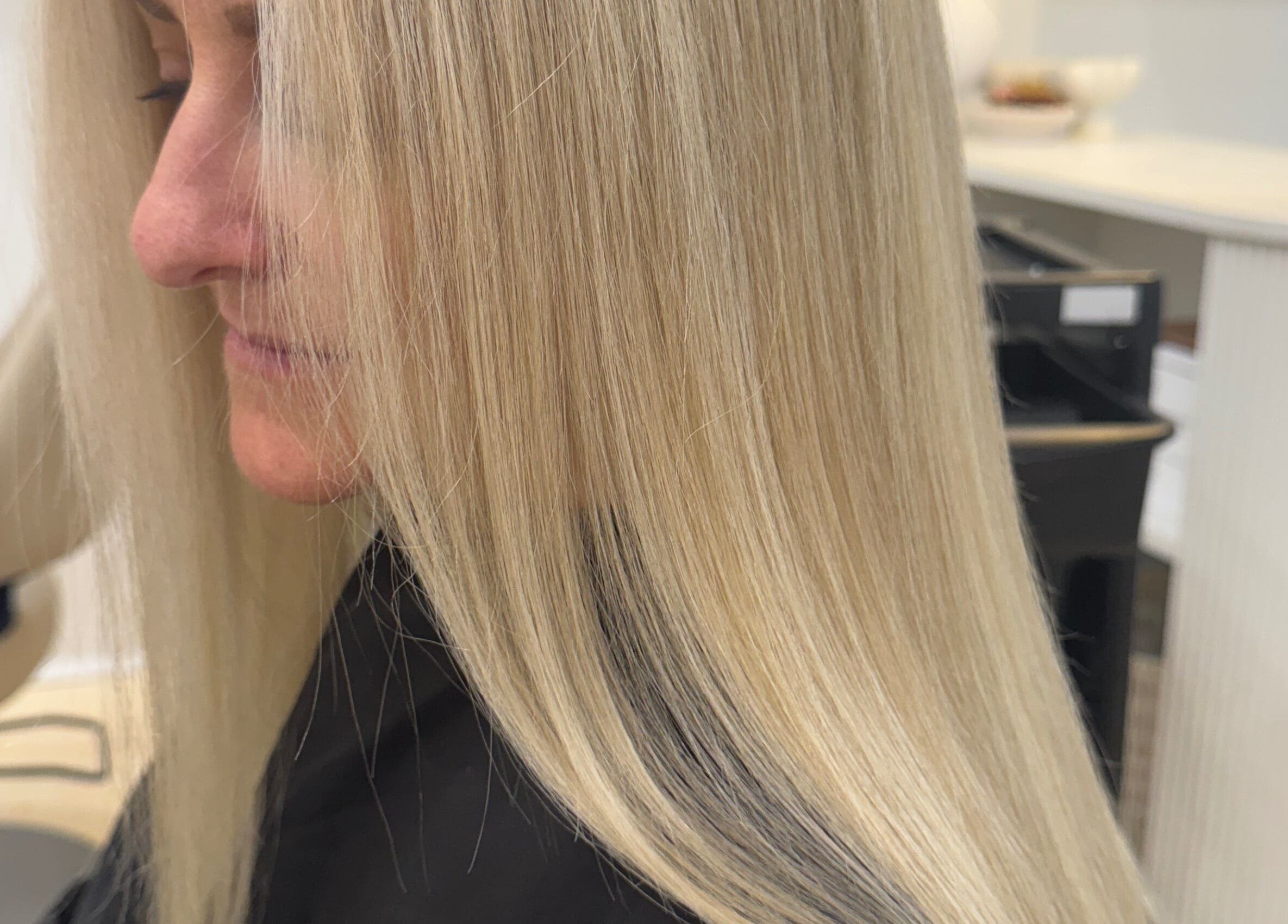 Close-up of sleek, blonde hair styled at StudioBlonde By Tahlia, Mona Vale, New South Wales, AU.