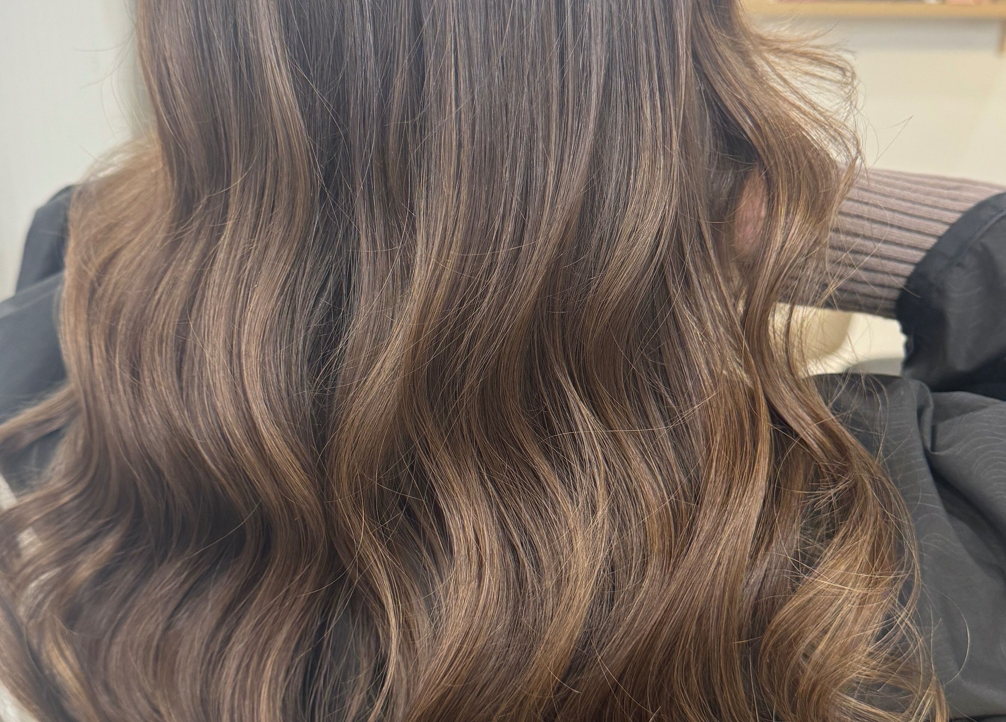 Beautiful wavy hair styled at StudioBlonde By Tahlia in Mona Vale, New South Wales, AU.