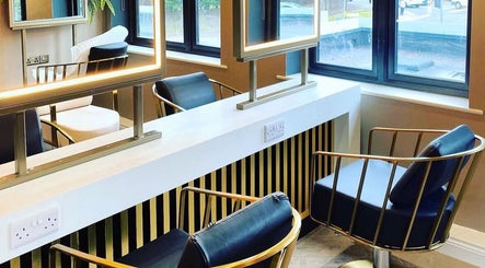 Chic interior of Kelly Michelle Hair Design salon in Stockton-on-tees, England, featuring modern styling chairs.