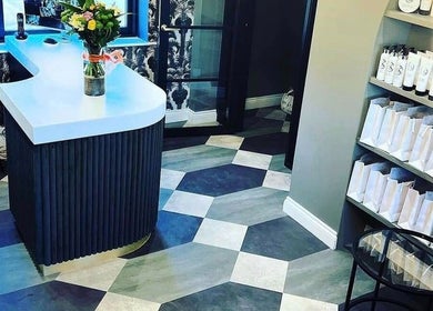 Stylish reception area at Kelly Michelle Hair Design, Stockton-on-tees, England, GB featuring modern decor.