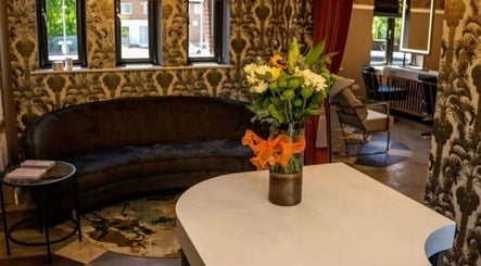 Chic lounge area at Kelly Michelle Hair Design, Stockton-on-tees, England, GB featuring stylish decor and seating.