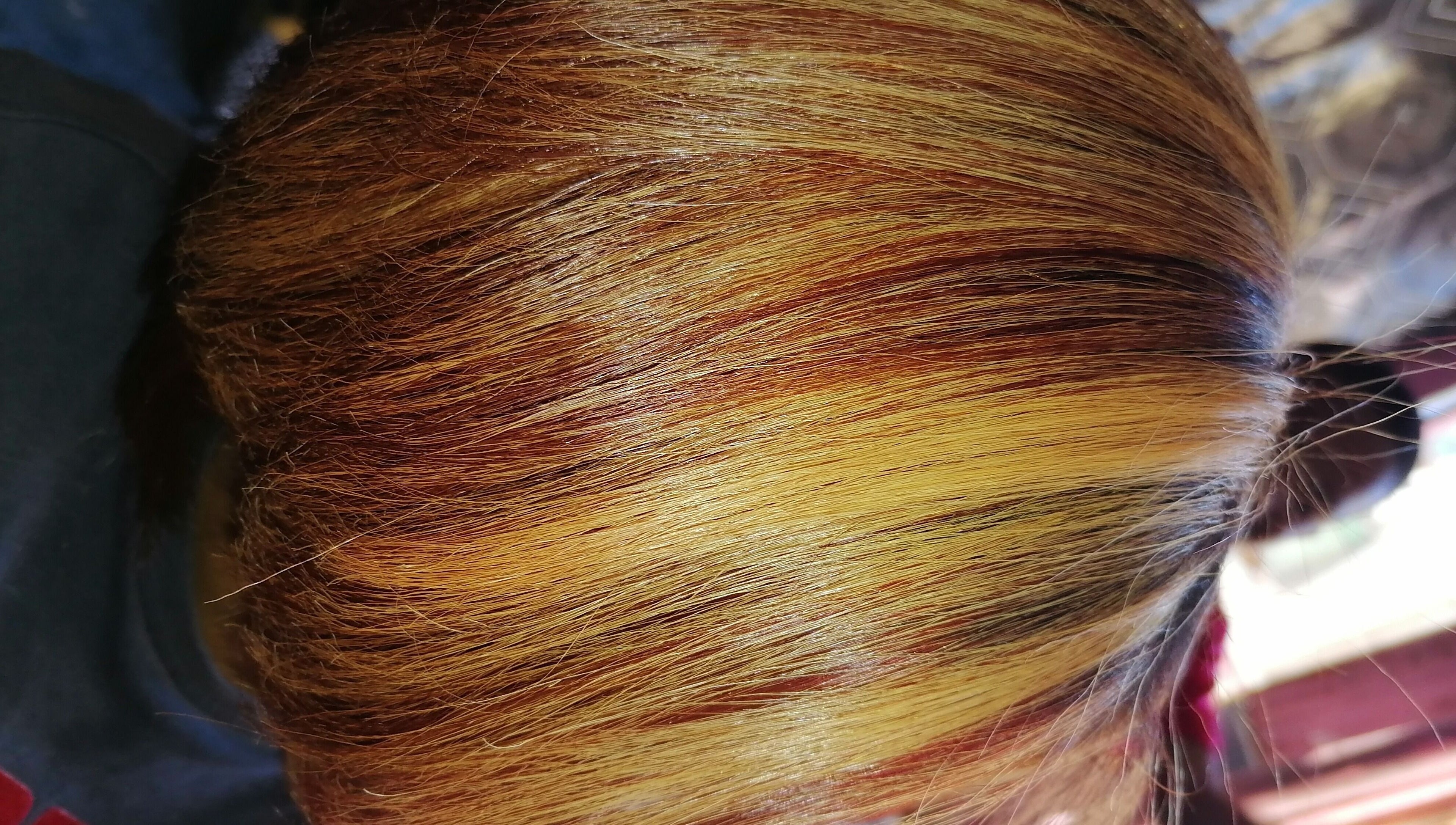 Vibrant hair color at Sassy hairstudio, Saldanha, Western Cape, ZA showcasing dynamic highlights.