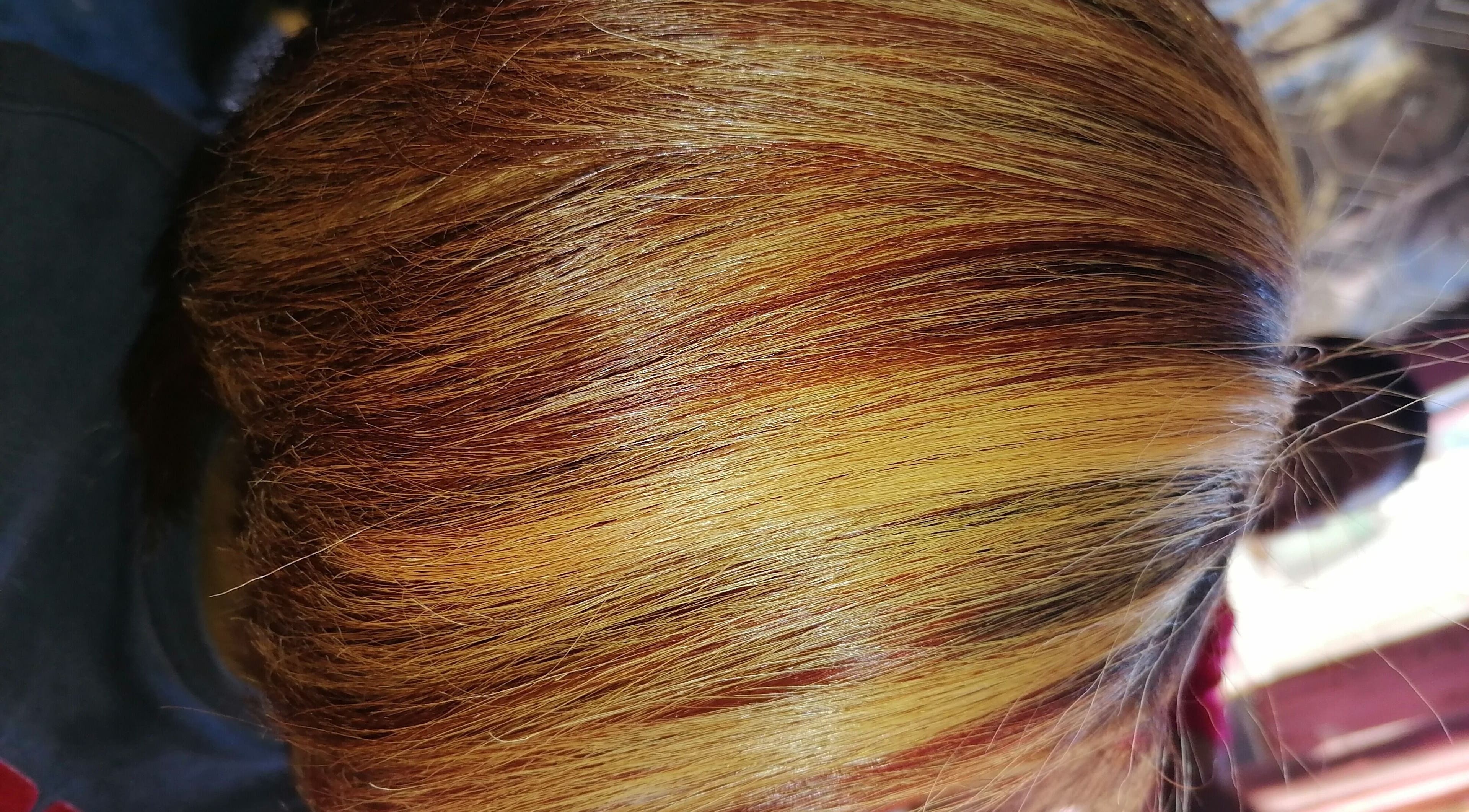 Vibrant hair color at Sassy hairstudio, Saldanha, Western Cape, ZA showcasing dynamic highlights.
