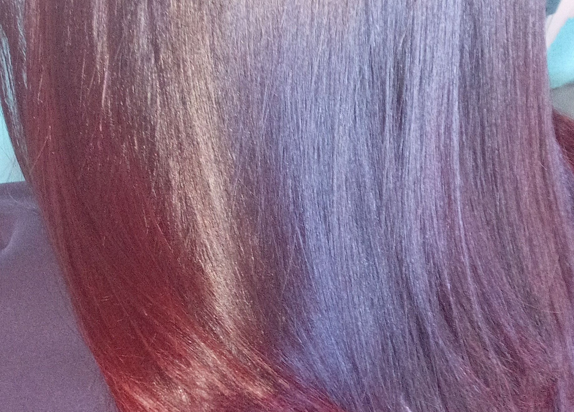 Vibrant hair color treatment at Sassy hairstudio, Saldanha, Western Cape, ZA showcasing rich hues and smooth texture.