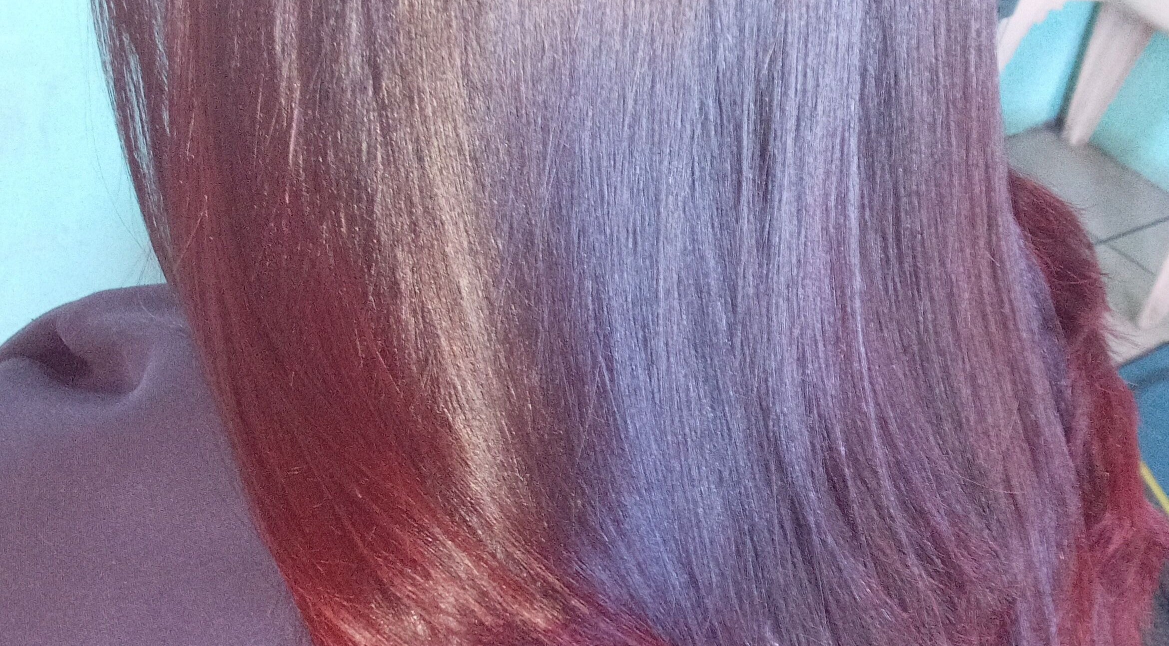 Vibrant hair color treatment at Sassy hairstudio, Saldanha, Western Cape, ZA showcasing rich hues and smooth texture.