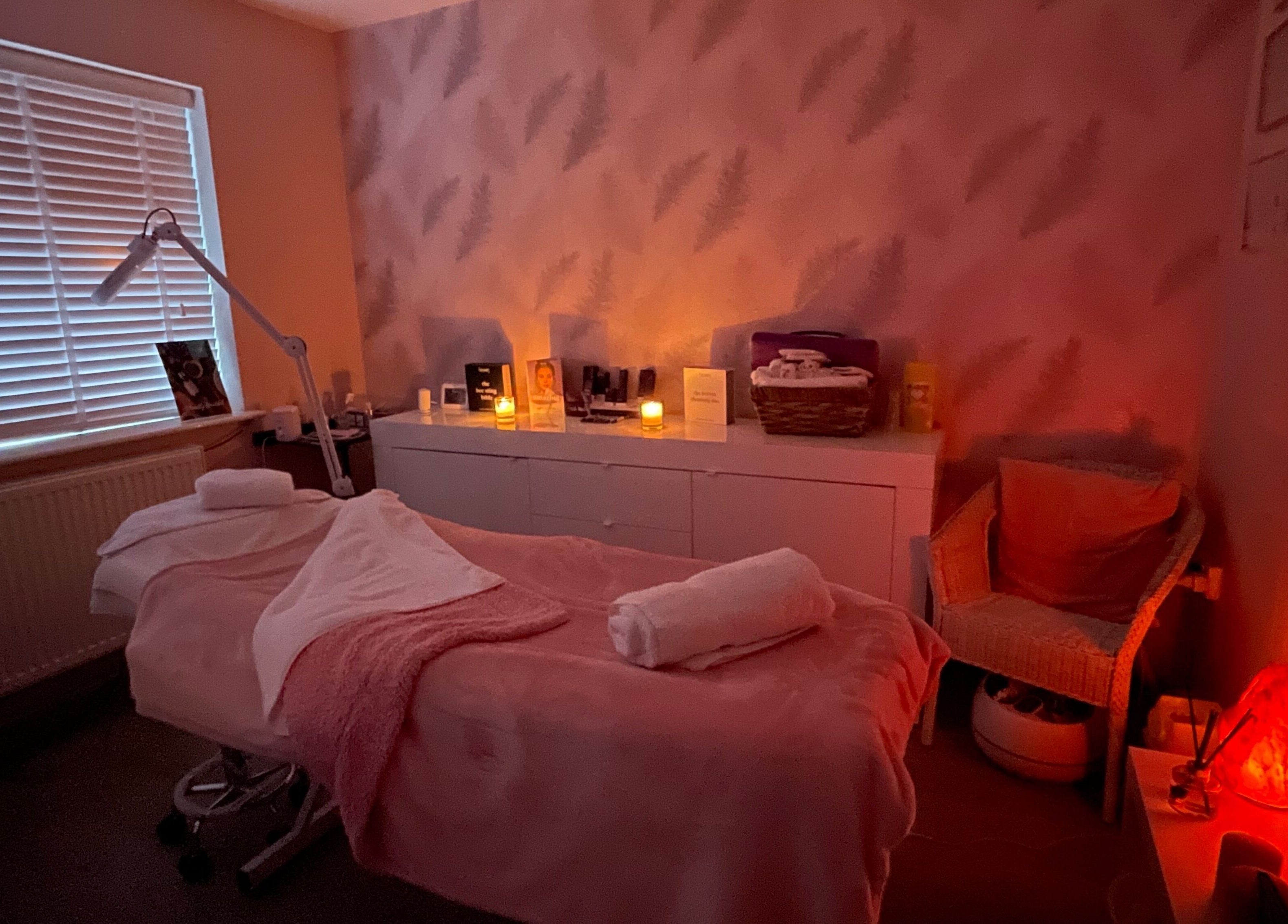 Relaxing treatment room at Fabulash Brow and Aesthetics, Wrexham, Wales, GB with ambient lighting.