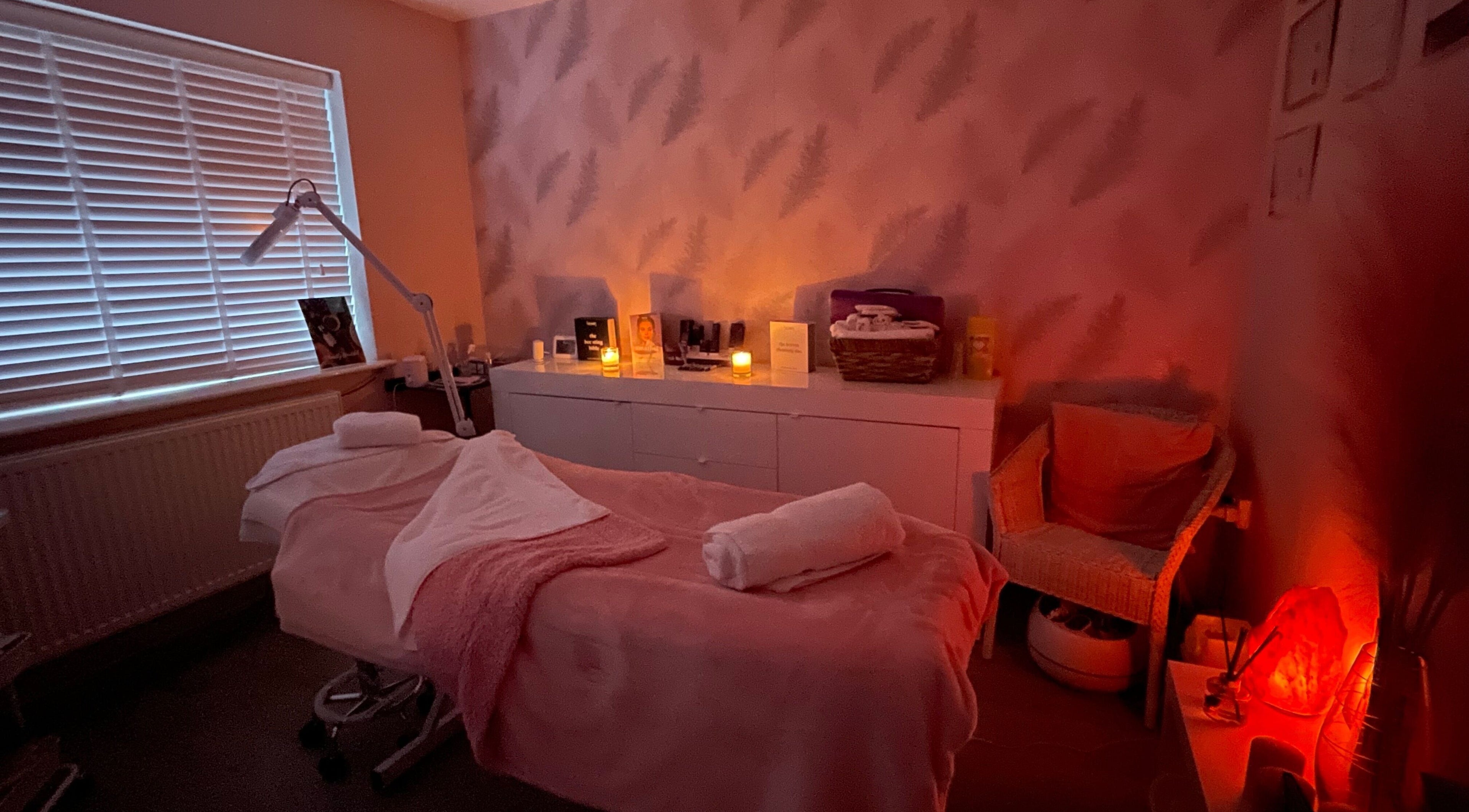 Relaxing treatment room at Fabulash Brow and Aesthetics, Wrexham, Wales, GB with ambient lighting.