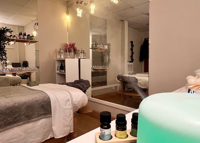 Relaxing therapy room at Mind & Soul Massage Therapy, Dublin, County Dublin, IE with ambient lighting and essential oils.