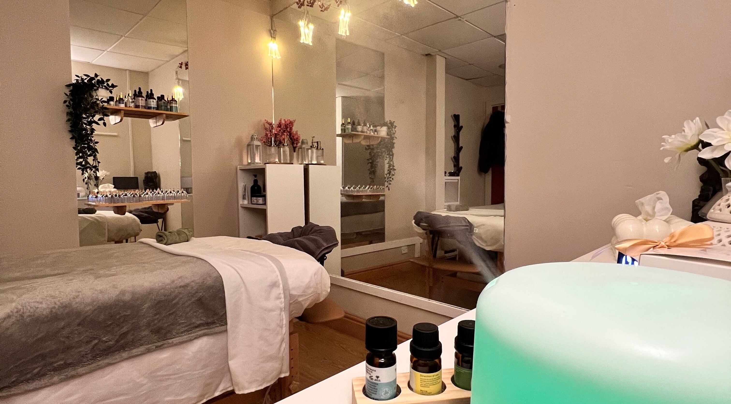 Relaxing therapy room at Mind & Soul Massage Therapy, Dublin, County Dublin, IE with ambient lighting and essential oils.