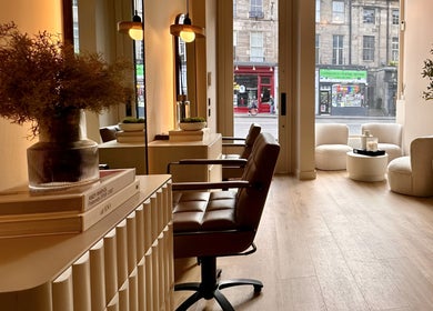 Modern interior of Laird & Co by Christopher Laird, Edinburgh, Scotland, GB with stylish chairs and lighting.