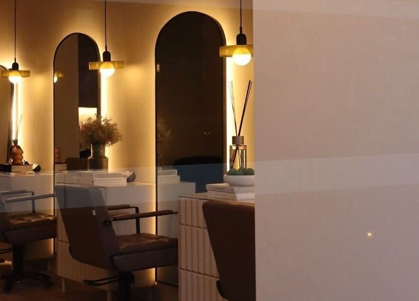 Stylish interior of Laird & Co by Christopher Laird in Edinburgh, Scotland, GB, featuring chic mirrors and seating.