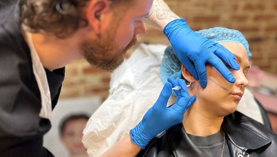 Professional performing aesthetic treatment at Hair & Aesthetics By Ryan, Wyboston, England, GB.