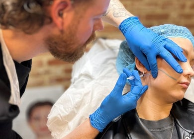 Professional performing aesthetic treatment at Hair & Aesthetics By Ryan, Wyboston, England, GB.