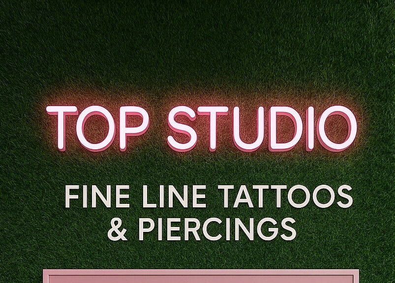 Neon sign of Top Studio Tattoo & Piercing located in Toronto, Ontario, CA, highlighting fine line tattoos.