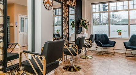 Elegant salon chairs and decor at The Hair Lounge, Chorley, England, GB.