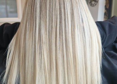 Gorgeous blonde hair styling at The Hair Lounge in Chorley, England, GB, showcasing sleek and polished look.