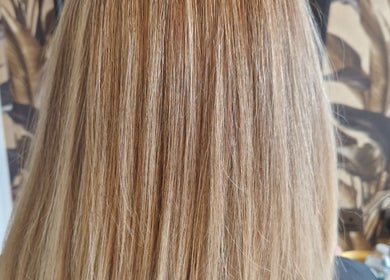 Sleek, blonde hair styled at The Hair Lounge, Chorley, England, GB.