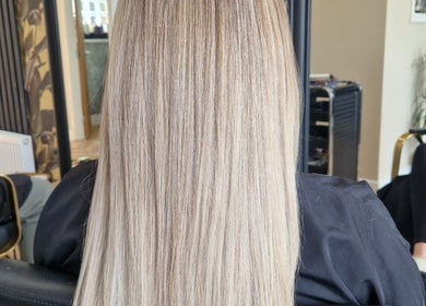 Smooth, straight blonde hair styled at The Hair Lounge, Chorley, England, GB, showcasing sleek salon results.