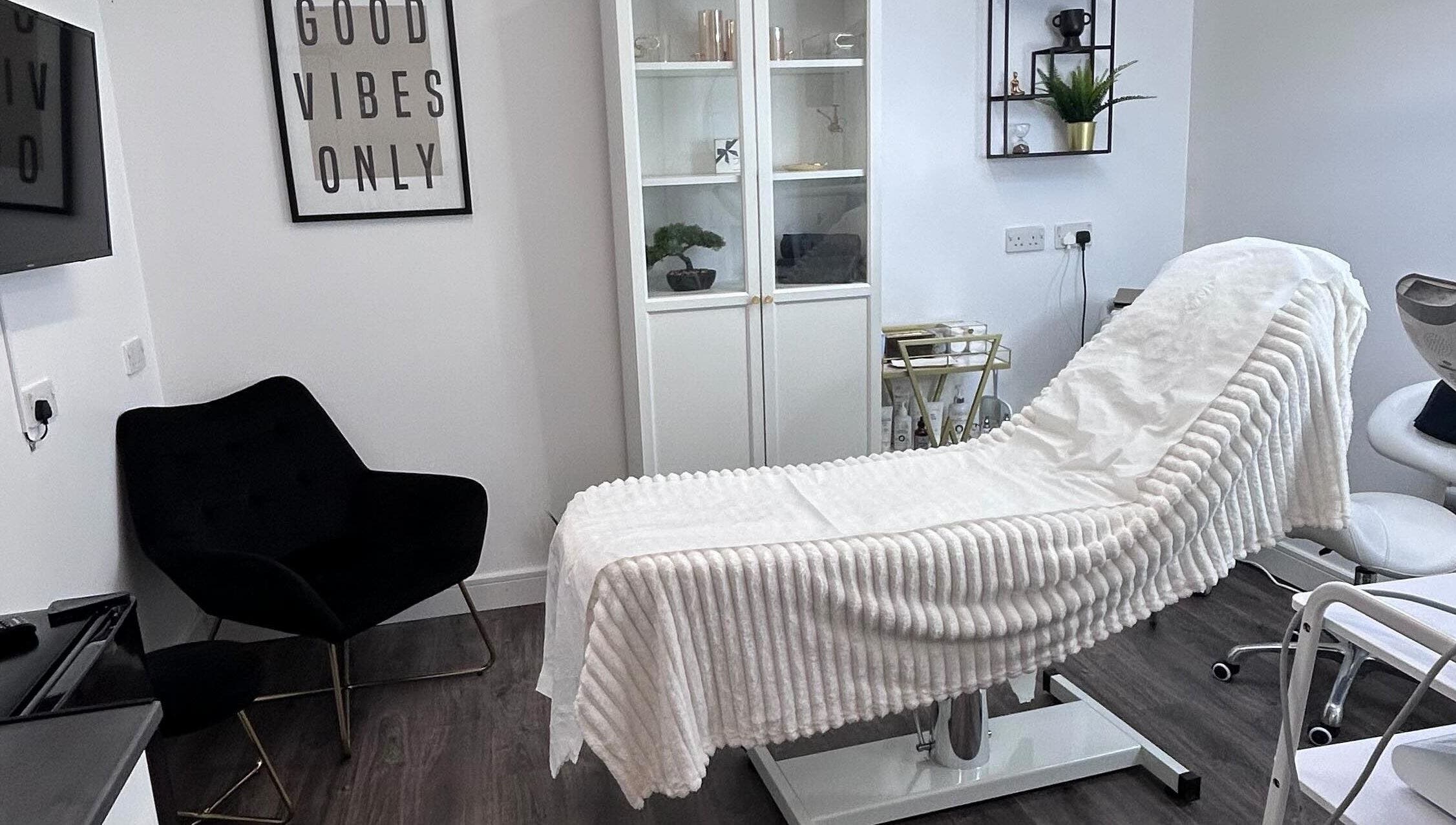 Studio 224 (Skin Guru) in Northampton, England, offers a serene treatment room with a cozy chair and a stylish decor.