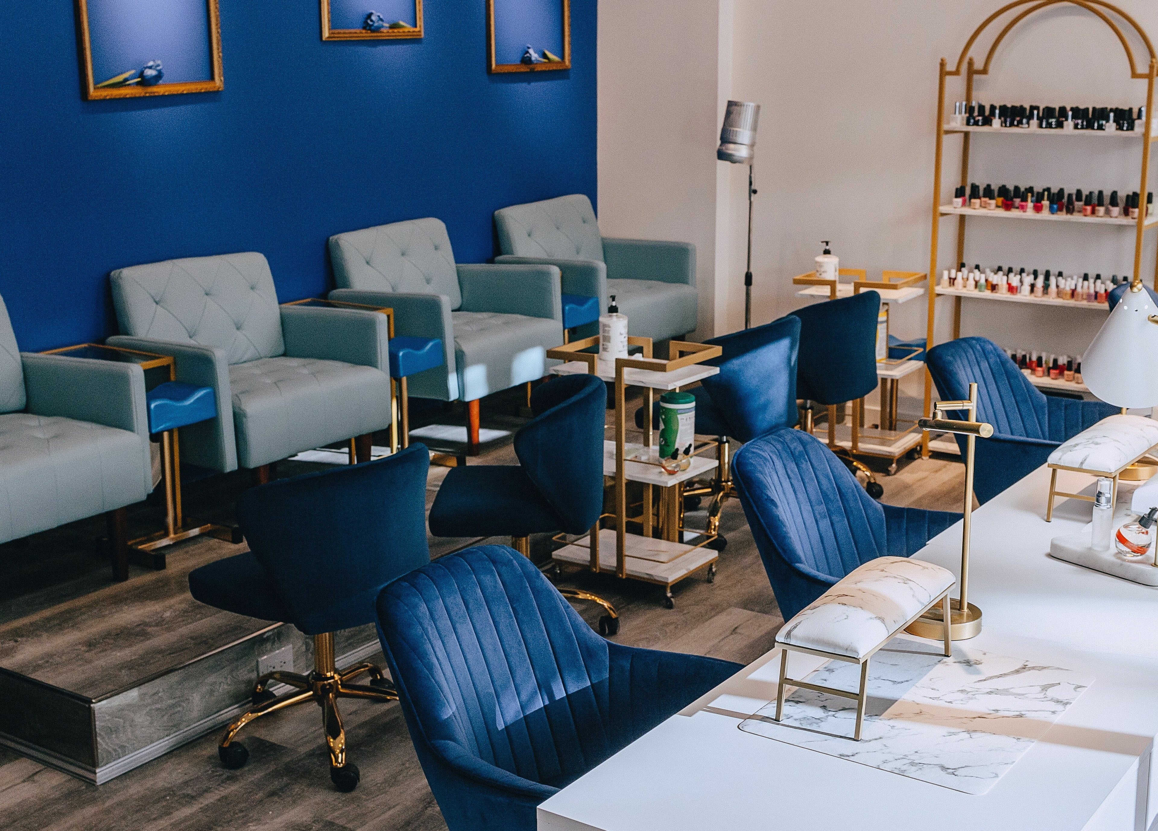Modern salon seating at Mon Cheri Chitown, Chicago, Illinois, US with blue decor and luxury chairs.